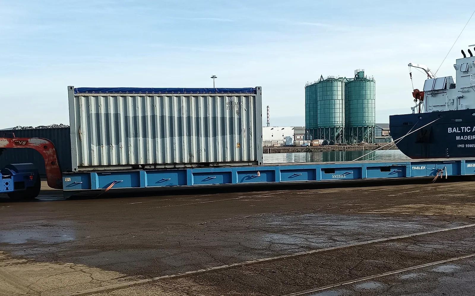Delta Novel container loaded onto an ocean vessel at an Italian Adriatic port — quay-side ocean freight operation.